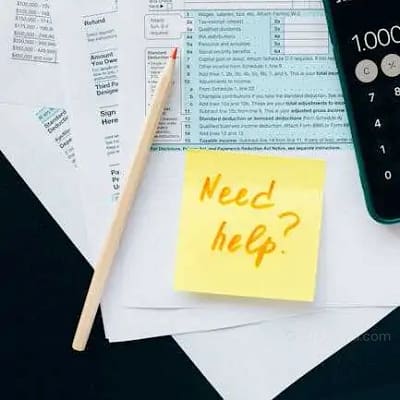 How to Apply for a USDA Protected Plant Permit (PPQ – CITES/ESA) - Import Permits Plant Regulations Close-up of tax forms with a calculator and a note asking for assistance.